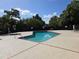 Community pool with ample deck space at 706 Golden Sunshine Cir, Orlando, FL 32807