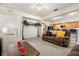 Relaxing living room with a brown sofa and a ceiling fan at 348 Sand Ridge Dr, Davenport, FL 33896