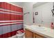 Clean bathroom with shower/tub combo, toilet and vanity at 348 Sand Ridge Dr, Davenport, FL 33896