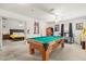 Game room with a pool table and views to the main bedroom at 348 Sand Ridge Dr, Davenport, FL 33896