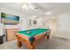 Upstairs game room with a pool table and ample space at 348 Sand Ridge Dr, Davenport, FL 33896
