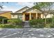 One-story home with yellow siding and a covered porch at 14132 Murcott Blossom Blvd, Winter Garden, FL 34787