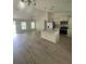 Open concept kitchen with island and living room view at 13394 Sw 106Th St, Dunnellon, FL 34432