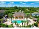 Resort-style community pool with lounge chairs and palm trees at 2335 Caravelle Cir, Kissimmee, FL 34746