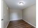 Empty bedroom with wood-look floors and neutral walls at 1313 Olive Ave, Sanford, FL 32771