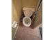 Simple toilet and tile flooring in a small bathroom at 2456 Sweetwater Club Cir # 20, Kissimmee, FL 34746
