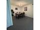 Bright dining area with a dark wood table and chairs for four at 2456 Sweetwater Club Cir # 20, Kissimmee, FL 34746