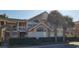 Inviting exterior of two-story condo with attractive landscaping and brick accents at 2456 Sweetwater Club Cir # 20, Kissimmee, FL 34746
