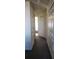 Clean hallway with carpet, doors to bedrooms and bath at 2456 Sweetwater Club Cir # 20, Kissimmee, FL 34746