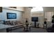 Bright living room featuring comfortable seating and a large TV at 2456 Sweetwater Club Cir # 20, Kissimmee, FL 34746