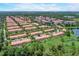Aerial view of community and surrounding landscape at 3004 Bird Of Paradise Ln, Kissimmee, FL 34747