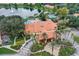 Community clubhouse and entrance with landscaping at 3004 Bird Of Paradise Ln, Kissimmee, FL 34747