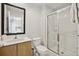Bathroom with a shower, toilet, and wood vanity at 3004 Bird Of Paradise Ln, Kissimmee, FL 34747