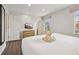 Main bedroom with king-size bed, TV, and ensuite bathroom access at 3004 Bird Of Paradise Ln, Kissimmee, FL 34747