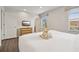 Main bedroom with king-size bed, TV, and ensuite bathroom access at 3004 Bird Of Paradise Ln, Kissimmee, FL 34747