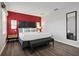 King size bed in bright bedroom with wood floors at 3004 Bird Of Paradise Ln, Kissimmee, FL 34747