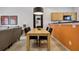 Light wood dining table with four black chairs, near living room at 3004 Bird Of Paradise Ln, Kissimmee, FL 34747