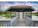 Serene gazebo over the lake with a fountain at 3004 Bird Of Paradise Ln, Kissimmee, FL 34747