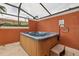 Relax in this private screened-in hot tub, perfect for unwinding after a long day at 3004 Bird Of Paradise Ln, Kissimmee, FL 34747