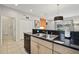 Modern kitchen with double sink, dishwasher, and granite countertops at 3004 Bird Of Paradise Ln, Kissimmee, FL 34747