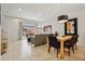 Open living area with patio access and adjacent dining area at 3004 Bird Of Paradise Ln, Kissimmee, FL 34747