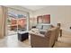 Living room with gray sofas, coffee table, and access to a patio with hot tub at 3004 Bird Of Paradise Ln, Kissimmee, FL 34747