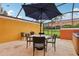 Screened patio with table and chairs at 3004 Bird Of Paradise Ln, Kissimmee, FL 34747