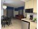 Small kitchen with refrigerator, microwave, and coffee maker at 6165 Carrier Dr # 2113, Orlando, FL 32819