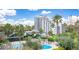 Aerial view showing a large building with pool at 6165 Carrier Dr # 2113, Orlando, FL 32819
