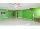 Green living room with tile floors, stairs, and ceiling fan at 6295 River Run Pl # 199, Orlando, FL 32807