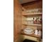 Cabinet stocked with glassware, plates, and mugs at 6337 Parc Corniche Dr # 2106, Orlando, FL 32821
