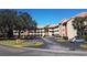 Two-story building with parking lot and landscaping at 6337 Parc Corniche Dr # 2106, Orlando, FL 32821