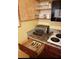 Kitchen with built-in appliances and drawer with cutlery at 6337 Parc Corniche Dr # 2106, Orlando, FL 32821