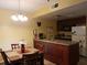 Kitchen with granite countertops and dark wood cabinets at 6337 Parc Corniche Dr # 2106, Orlando, FL 32821