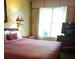 Bedroom with a queen bed, dresser and TV at 6337 Parc Corniche Dr # 2106, Orlando, FL 32821
