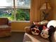 Living room with seating area and view of green space at 6337 Parc Corniche Dr # 2106, Orlando, FL 32821