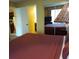Bedroom with a view into the kitchen and a queen bed at 6337 Parc Corniche Dr # 2106, Orlando, FL 32821