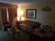 Living room with sofa, armchair, and dining area at 6337 Parc Corniche Dr # 2106, Orlando, FL 32821