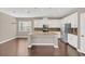 Large kitchen island with granite countertop and seating at 8795 Ribault Ave, Orlando, FL 32832