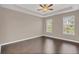 Spacious bedroom with hardwood floors and ceiling fan at 8795 Ribault Ave, Orlando, FL 32832