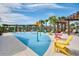 Community splash pad with colorful chairs and shade structures at 8795 Ribault Ave, Orlando, FL 32832