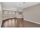 Spacious living area with hardwood floors and two chandeliers at 8795 Ribault Ave, Orlando, FL 32832