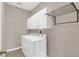 Laundry room with washer, dryer, and storage cabinets at 8795 Ribault Ave, Orlando, FL 32832