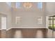 Bright great room featuring high ceilings and hardwood floors at 8795 Ribault Ave, Orlando, FL 32832