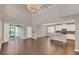 Open kitchen with granite countertops, white cabinets, and a large island at 8795 Ribault Ave, Orlando, FL 32832