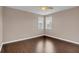 Spacious bedroom with dark hardwood floors at 8795 Ribault Ave, Orlando, FL 32832
