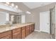 Primary bathroom boasts double vanity, granite countertop, and large shower at 8795 Ribault Ave, Orlando, FL 32832