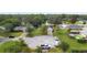 Aerial view of homes and a cul-de-sac with parked vehicles at 2500 Cherry Blossom Ct, Eustis, FL 32726