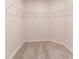 Walk in closet with wire shelving and neutral carpeting at 207 Goldenrod Ln, Kissimmee, FL 34759