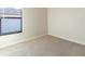 Simple bedroom with a window and neutral walls at 207 Goldenrod Ln, Kissimmee, FL 34759